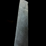 Cutbank stainless Damascus steel billet made from AEB-L and 302 with flowing river contour pattern on black background