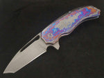 Folding knife made with herringbone pattern stainless damascus and zirmascus handles