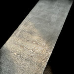 Detailed view of our stainless Ladder Pattern San Mai billet, forged with an AEB-L core and AEB-L/304 Damascus jackets. This material combines clean stainless performance with a striking ladder pattern for premium knife making.