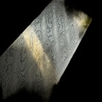 Detailed view of our Tilted Ladder San Mai billet, forged with a high-performance AEB-L core and AEB-L/304 stainless Damascus jackets. The angled ladder pattern gives this stainless san mai a distinctive, directional look.