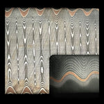 close up picture of a copper infused san mai damascus billet in ladder pattern, forged by vegas forge
