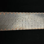 picture of a copper infused san mai damascus billet in ladder pattern, forged by vegas forge