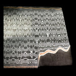 close up picture of a reptilian patterned san mai damascus billet with copper layers like gomai. made by vegas forge