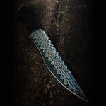 Close-up of Copperhead San Mai fixed blade showing copper-infused Damascus pattern