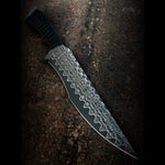 fixed blade sitting on machine made out of copper infused reptilian pattern san mai