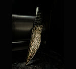copperhead san mai fixed blade resting on vegas forge rolling mill