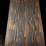 Close-up of DarkFire San Mai showing flowing copper, nickel, and etched 1075 carbon-steel layers.