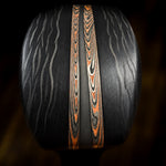 End-on detail of a custom knife handle with DarkFire San Mai accents and black patterned scales.