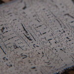 Close-up of Dot Matrix Damascus steel billet showing pixel grid pattern