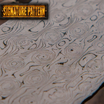 metal damascus surface with swirling fireball pattern and 'Signature Pattern' label.