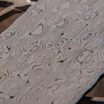 close up picture of fireball patterned stainless damascus made by vegas forge