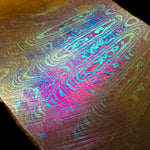 zoomed in image of the ladder pattern damtanium billet forged by vegas forge
