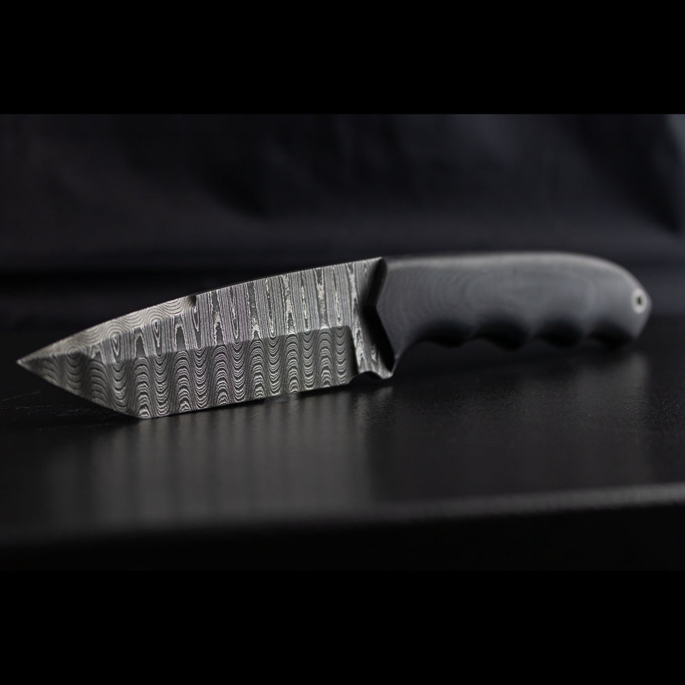 tanto fixed blade with black carbon fiber handles and blade made with stainless ladder pattern damascus