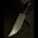 stainless lightning patterned damascus steel knife on metal table covered in metal scale