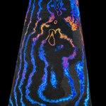 a flat bar of random pattern zirmascus also known as black ti or zircuti featuring bright blue, grey and yellow colors