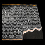 close up picture of a reptilian patterned san mai damascus billet with copper layers like gomai. made by vegas forge