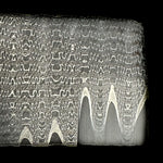 close up picture of vegas forges stainless san mai billet with bevel ground exposing the solid core