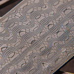 reptilian patterned stainless steel damascus billet close up