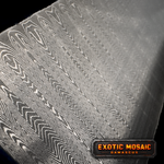 Close-up of a textured sharktooth pattern damascus surface with a 'Signature Pattern' label.