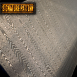 Close-up of a textured sharktooth pattern damascus surface with a 'Signature Pattern' label.