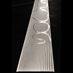 top view of a stainless spirograph pattern damascus block on a black background