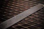 A acid etched billet of stainless spirograph damascus