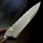 chef knife with vegas forge logo made out of stainless random pattern san mai