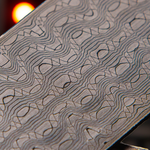 detailed close view of a reptilian pattern damascus billet made in USA