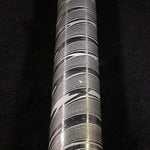 close up picture of a stainless twist damascus round bar on black background