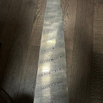 twist pattern damascus steel billet stainless on wood background