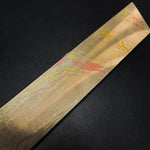 billet of twist pattern mokume sitting on dark surface