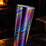 a twisted damtanium round bar made with layers of grade 2 titanium and grade 5 titanium, also known as titanium damascus, mokuti of timascus