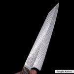 a kitchen knife from meglio knoves made with vegas forge twisted thorn damascus