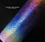 Colorful Damascus steel blade with 'Typhoon Damtanium' branding on a black background