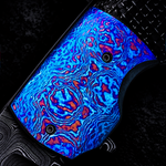 bright blue and red flame annodized titanium damascus bolster on custom piece, laying on black and grey background