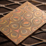 close up of a typhoon pattern mokume billet made with layers of copper, brass and nickel-silver