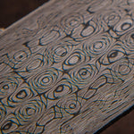 close up picture of a damascus steel billet forged by vegas forge in vines and roses pattern