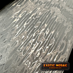 a billet of stainless virus pattern damascus forged by vegas forge on a black background
