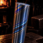zirmascus twist round bar also known as black ti or zircuti with blacksmiths forge in background